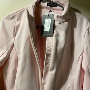 Pastel pink ski suit